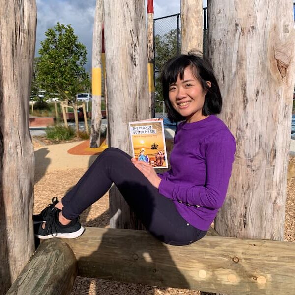 Image of the author holding a copy of The Peanut Butter Pirate Has A Surprising Day